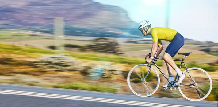 Fast, fitness and a man cycling on the road for cardio, sports or marathon training on a bike. Focus, exercise and a moving cyclist on bicycle for a challenge, triathlon or competition in the street.