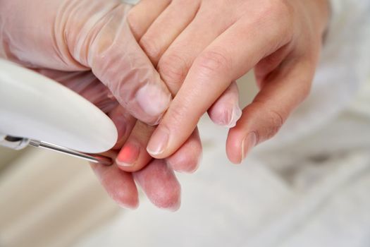 Laser treatment of nails in a beauty salon, hand care