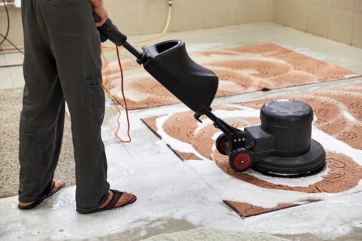 Carpet chemical cleaning with professionally disk machine. Early spring cleaning or regular clean up. High quality photo