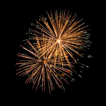 Colorful fireworks isolated on black sky background.