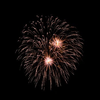 Colorful fireworks isolated on black sky background.