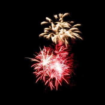 Colorful fireworks isolated on black sky background.