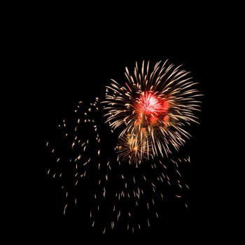 Colorful fireworks isolated on black sky background.