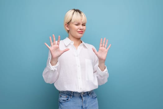 young pretty caucasian blond career woman in white blouse refuses job offer.