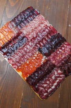 Dried meat for sandwiches. Thinly sliced smoked meat. Meat cuts. Hamon
