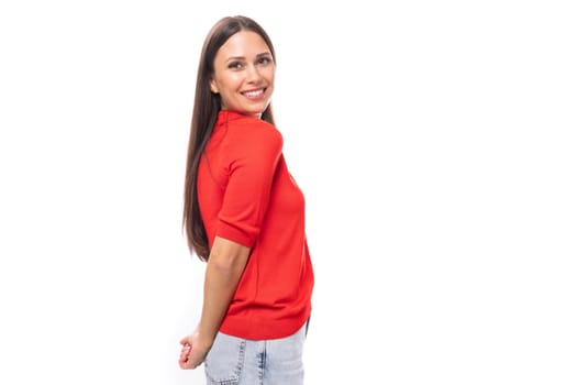 young smiling pretty caucasian brunette in a red short sleeve shirt on a white background with copy space.