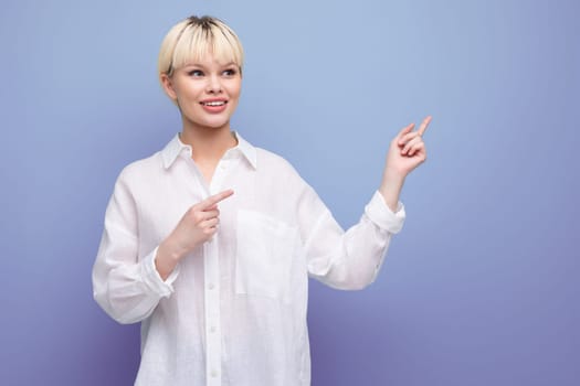 a stylish fashionable woman with a bob haircut dressed in a white shirt points with her hands in different directions. business concept.