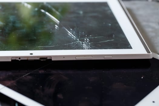 Tablet repair, replacement of glass on the tablet. Broken glass on a mobile device