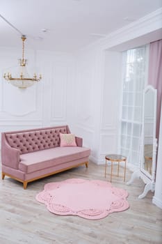 Handmade carpet knitted from natural threads, flooring, natural cotton. Pink handmade carpet. Interior solution for a house or apartment