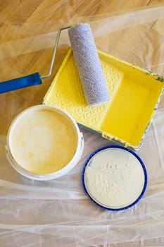 Close-up of paint roller while working indoors, renovation work