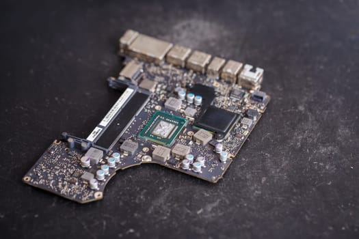 Professional computer and tablet repair shop or service. Close up of a computer board. Electronics concept. Detail from a laptop under repair
