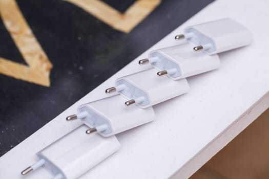 Chargers blocks for charging the phone in white.