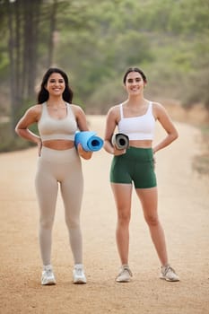 Fitness, portrait or women friends in nature for yoga exercise to start workout or body training. Healthy athlete smile, relaxed girls or happy people ready for outdoor exercising together on mat.