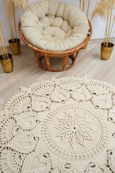 Cute homemade thick thread knitting pattern made by hand: handmade beige thread rug, woven pattern, rustic traditions, knitting art