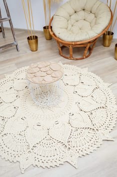 Cute homemade thick thread knitting pattern made by hand: handmade beige thread rug, woven pattern, rustic traditions, knitting art