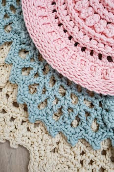 On the floor is a knitted cotton carpet, decorative floor carpets. top view handmade.