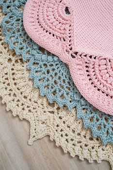 On the floor is a knitted cotton carpet, decorative floor carpets. top view handmade.