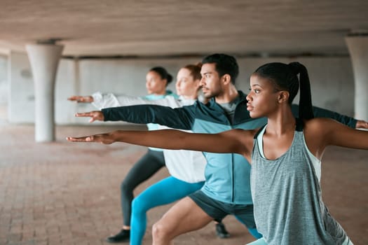 Team, exercise and friends stretching as a fitness club for sports, health and wellness in an urban class together. Sport, commitment and people training or group doing pilates workout in yoga.