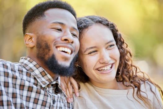 Happy, love and a couple in the park during summer for a romantic date in celebration of their anniversary. Smile, romance or affection with a man and woman outdoor in nature or a green garden.