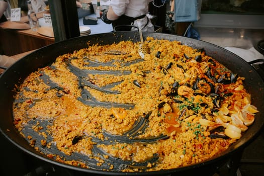 Seafood paella freshly prepared on a street food market