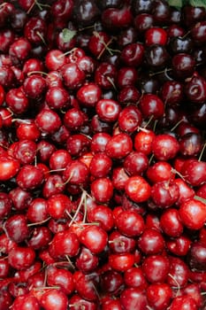 Pile of fresh cherries on sale on a green market