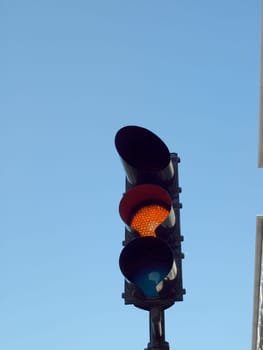 A traffic light with an orange light on it in San Francisco, California.