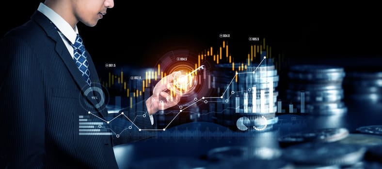 Businessman analyst working with digital finance business data graph showing technology of investment strategy for perceptive financial business decision. Digital economic analysis technology concept.