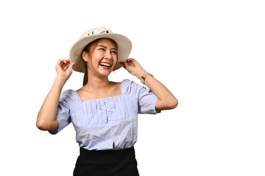 Portrait of smiling young woman in summer hat and casual clothes isolated on white background. Holiday, vacation, traveling concept.