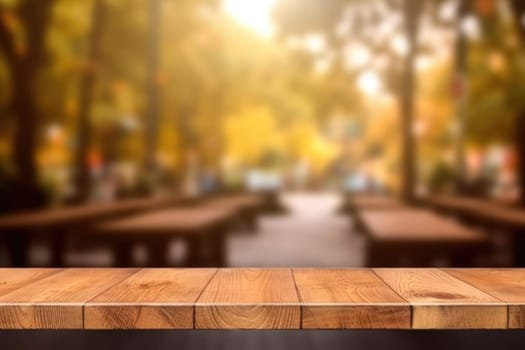 The empty wooden table top with blur background. Exuberant image.