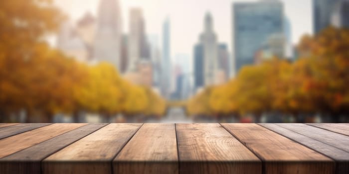 The empty wooden table top with blur background of business district and office building in autumn. Exuberant image.