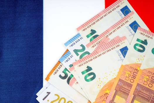Euro banknote on France flag.