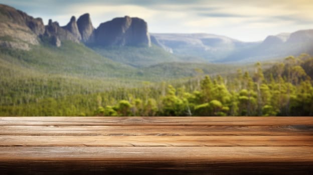 The empty wooden brown table top with blur background of Cradle mountain in Tasmania. Exuberant image.