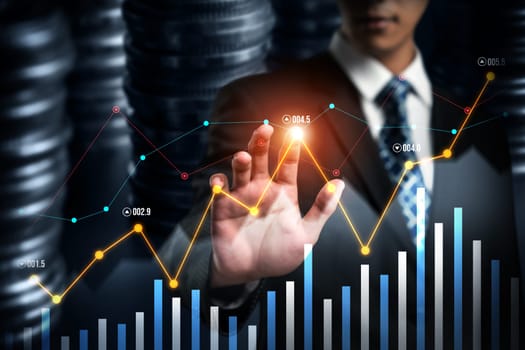 Businessman analyst working with digital finance business data graph showing technology of investment strategy for perceptive financial business decision. Digital economic analysis technology concept.