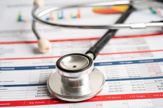 Stethoscope on spreadsheet and graph paper, Finance, Account, Statistics, Investment, Analytic research data economy and Business company concept.