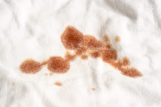 Dirty sauce stain on cloth to wash with washing powder, cleaning housework concept.