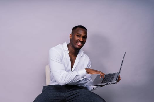 African American millennial businessman isolated on a studio background, successful male formal suit