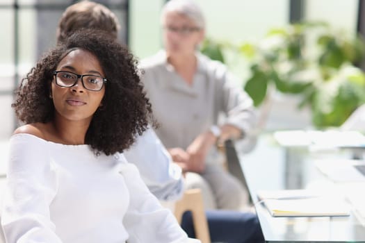portrait of a young african american woman in the office