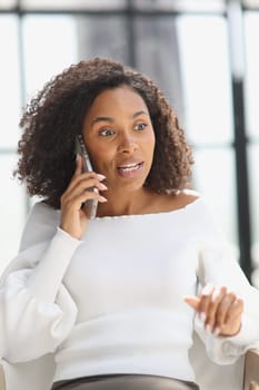 Portrait of a young African American woman using a smartphone