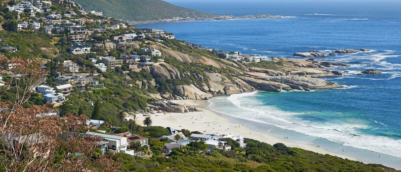 Mountain, beach and aerial of city by ocean in South Africa for tourism, traveling and global destination. Landscape, background and view of sea by urban town for adventure, vacation and holiday.