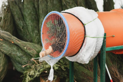 A Christmas tree packed in plastic net