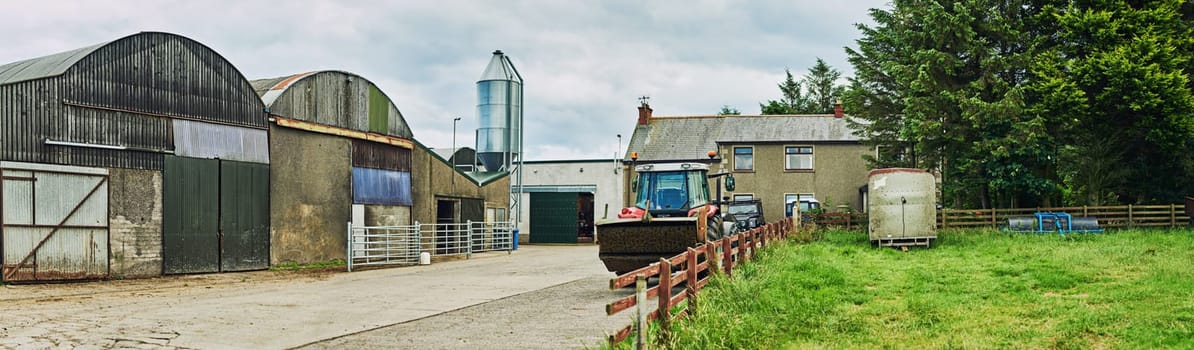 The picture of a well-kept farm. a dairy factory on wide open farmland in the countryside
