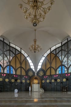 Bangkok, Thailand - May 28, 2023 - The Imam is the leader of the prayer, Religious muslim man praying for God on the floor in the Central Mosque and Islamic Center of Thailand. The religion of islam, Space for text, Selective focus.