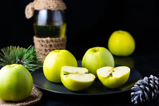 Ripe green apple fruits on a dark stone table. Top view with copy space. Flat lay