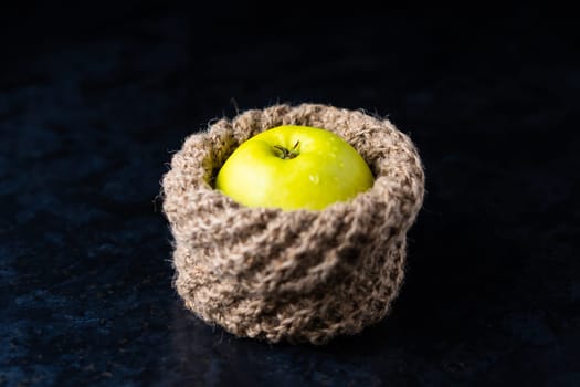 Ripe green apple fruits on a dark stone table. Top view with copy space. Flat lay