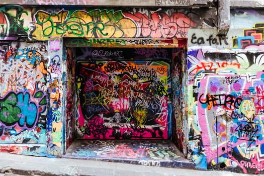 MELBOURNE, AUSTRALIA - June 25 2023: Melbourne's famous Hosier Lane featuring graffiti artwork and grunge urban feel