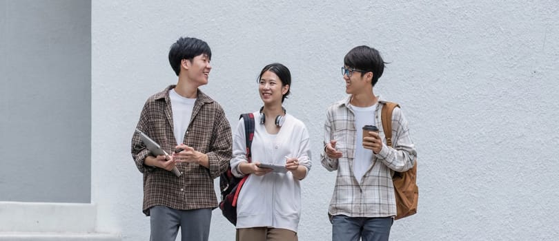 Outdoor of smiling university young group students college man and women students college smiling stand holding books and laptop computers on campus, Education concept, Back to college concept..