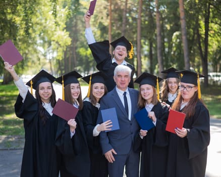 University professor and seven graduates rejoice at graduation