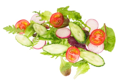 cut cucumbers, garden radish, tomatoes and lettuce leaves isolated on the white