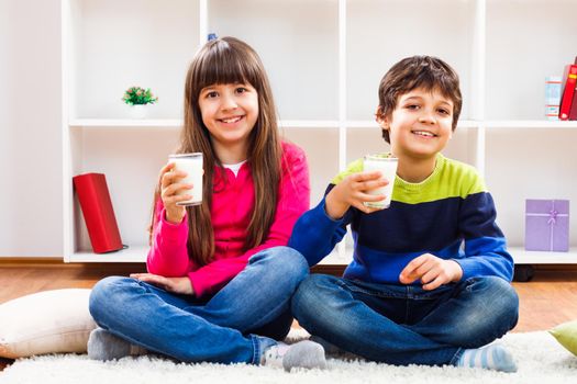 Image of happy children drinking milk.