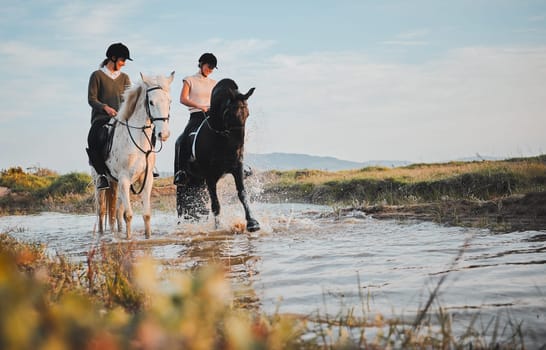 Horse riding, friends and girls at lake in countryside with outdoor mockup space. Equestrian, happy women and animals in water, nature and adventure to travel, journey and summer vacation together